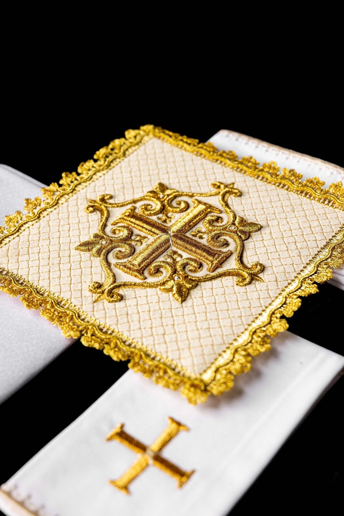 Velvet altar linen set close-up showing quilted ecru fabric and gold cross embroidery