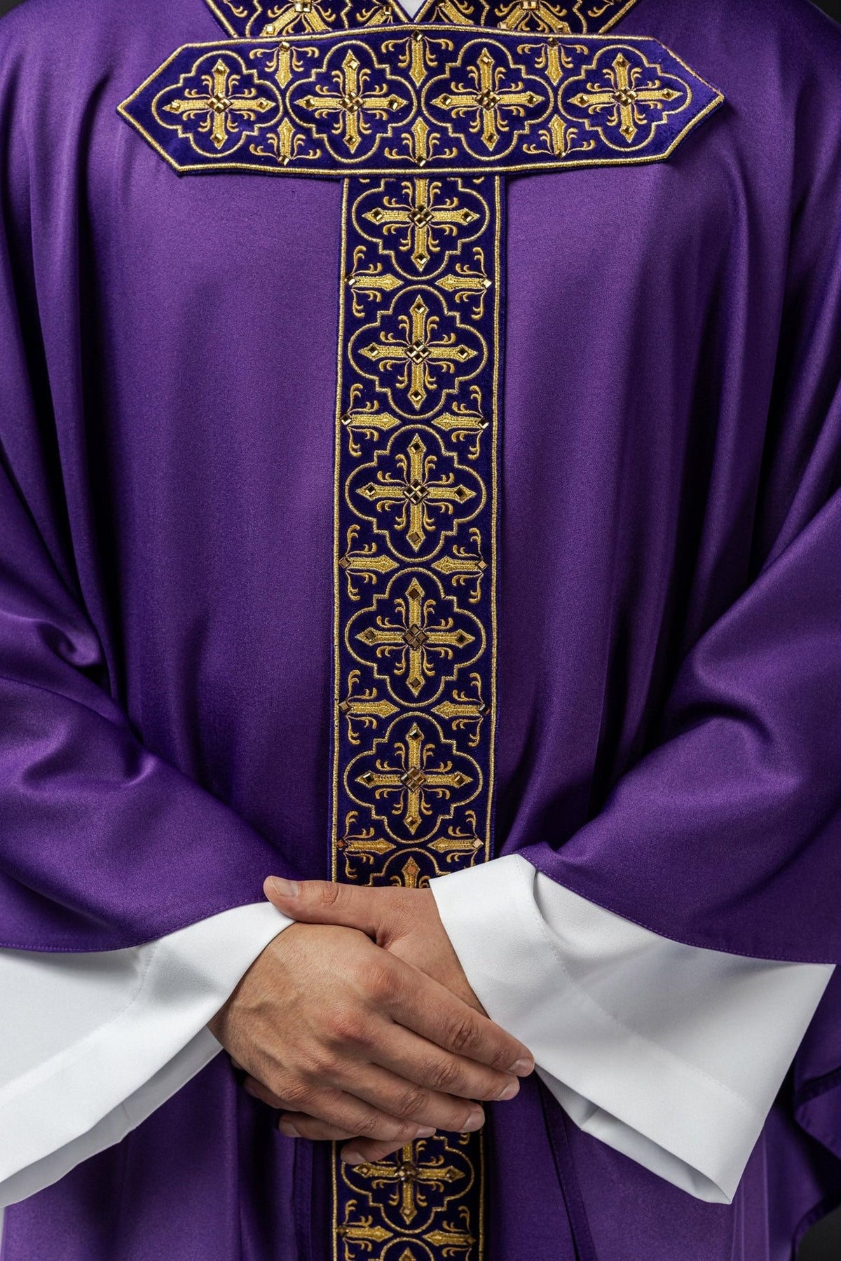 Purple chasuble close-up of embroidered gold cross orphrey with decorative stones