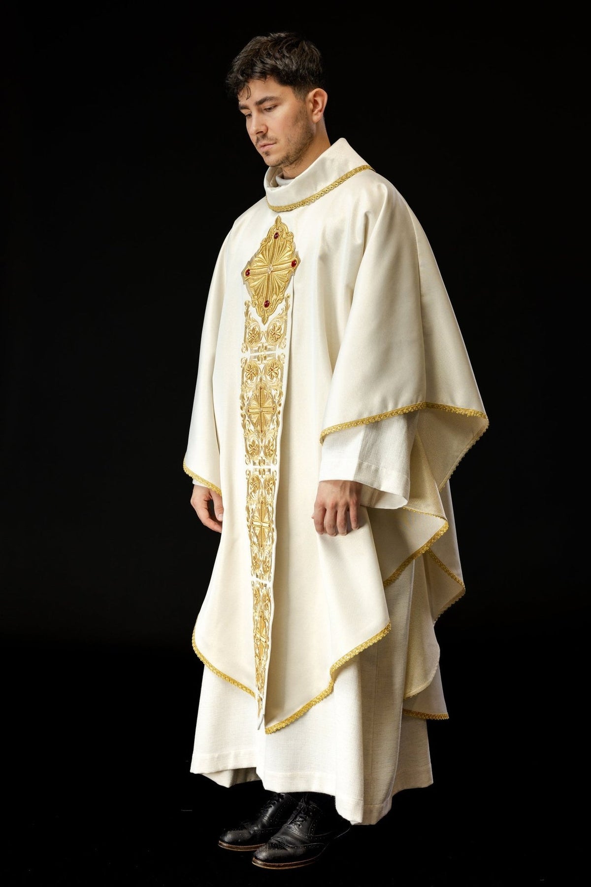 Gold chasuble worn, front three-quarter view with embroidered cross