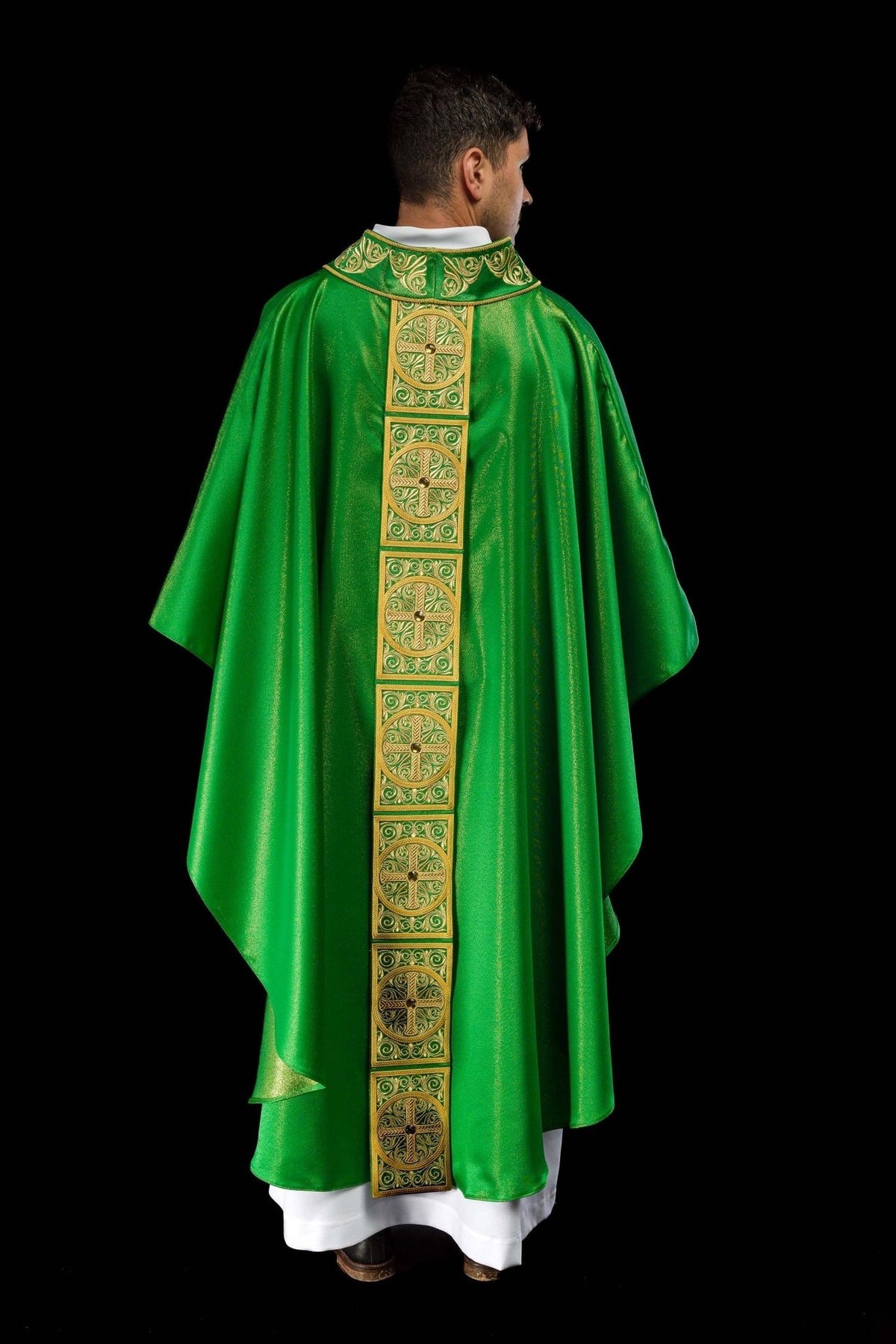 Green chasuble back orphrey close-up with embroidered cross and faceted stone