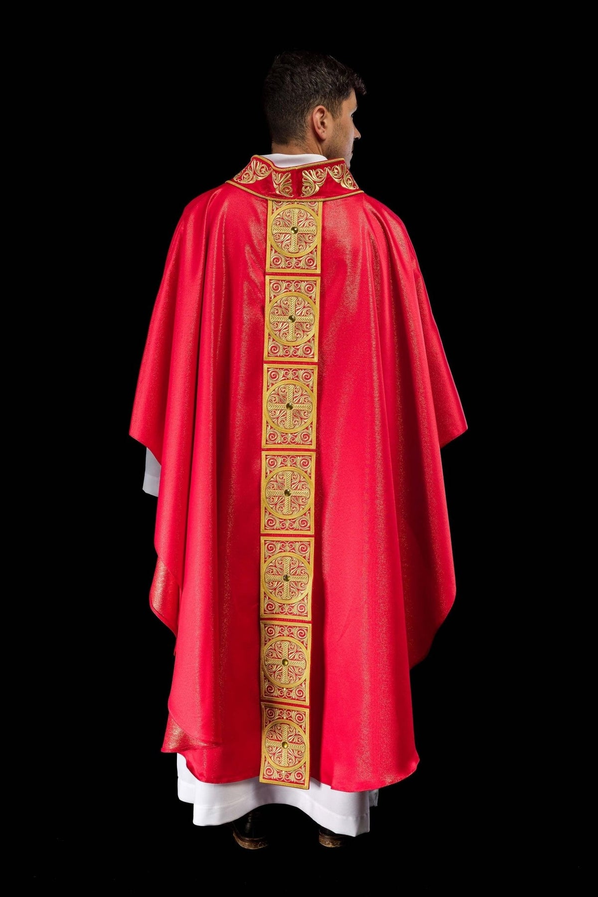 Red chasuble back view with embroidered orphrey and faceted stones