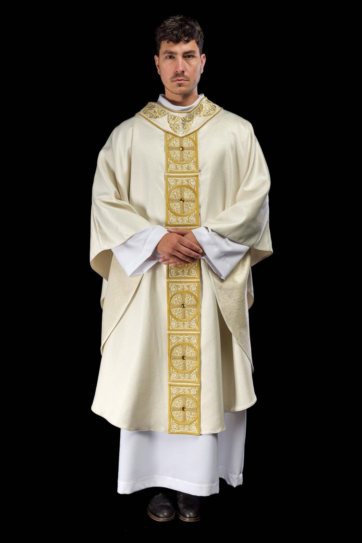 Gold chasuble front view with embroidered orphrey and faceted stones
