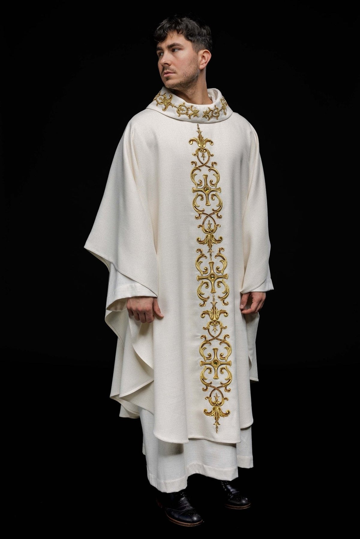 Catholic chasuble, full white front view with a long gold embroidered cross motif