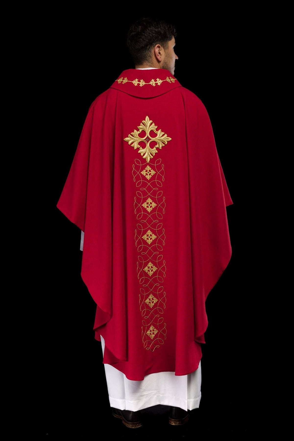 Red chasuble, full back view with embroidered cross and repeating gold cord design