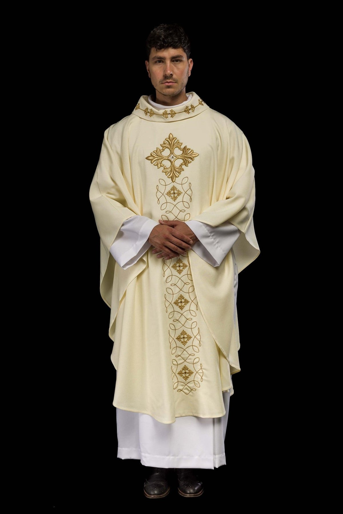 Ivory embroidered chasuble, full front view with gold cross and scrolling motifs