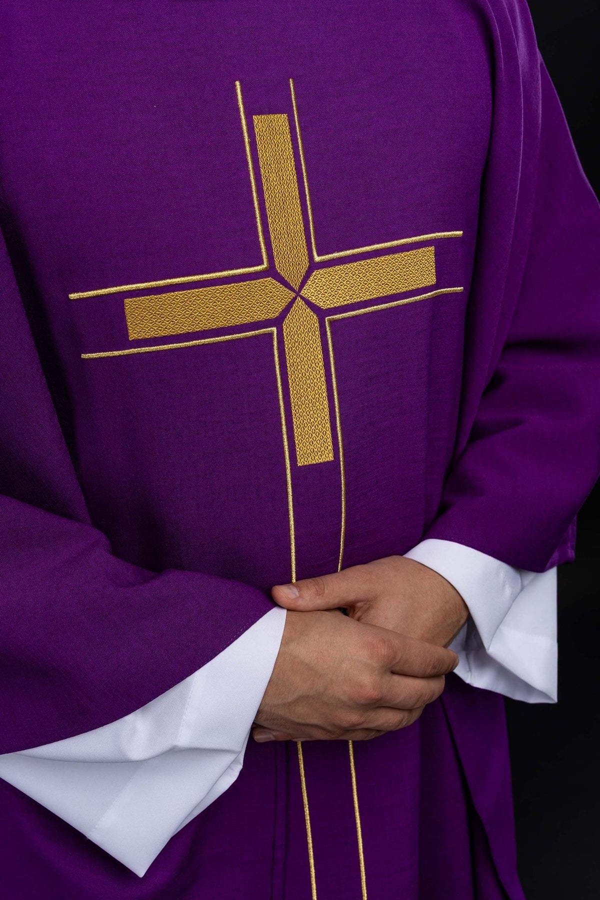 Purple chasuble close-up of gold cross embroidery