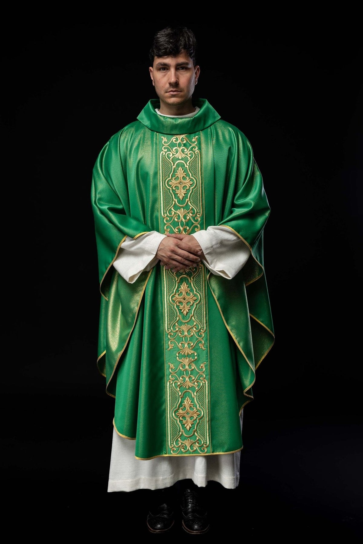 Green embroidered chasuble, full front view with ornate gold central embroidery