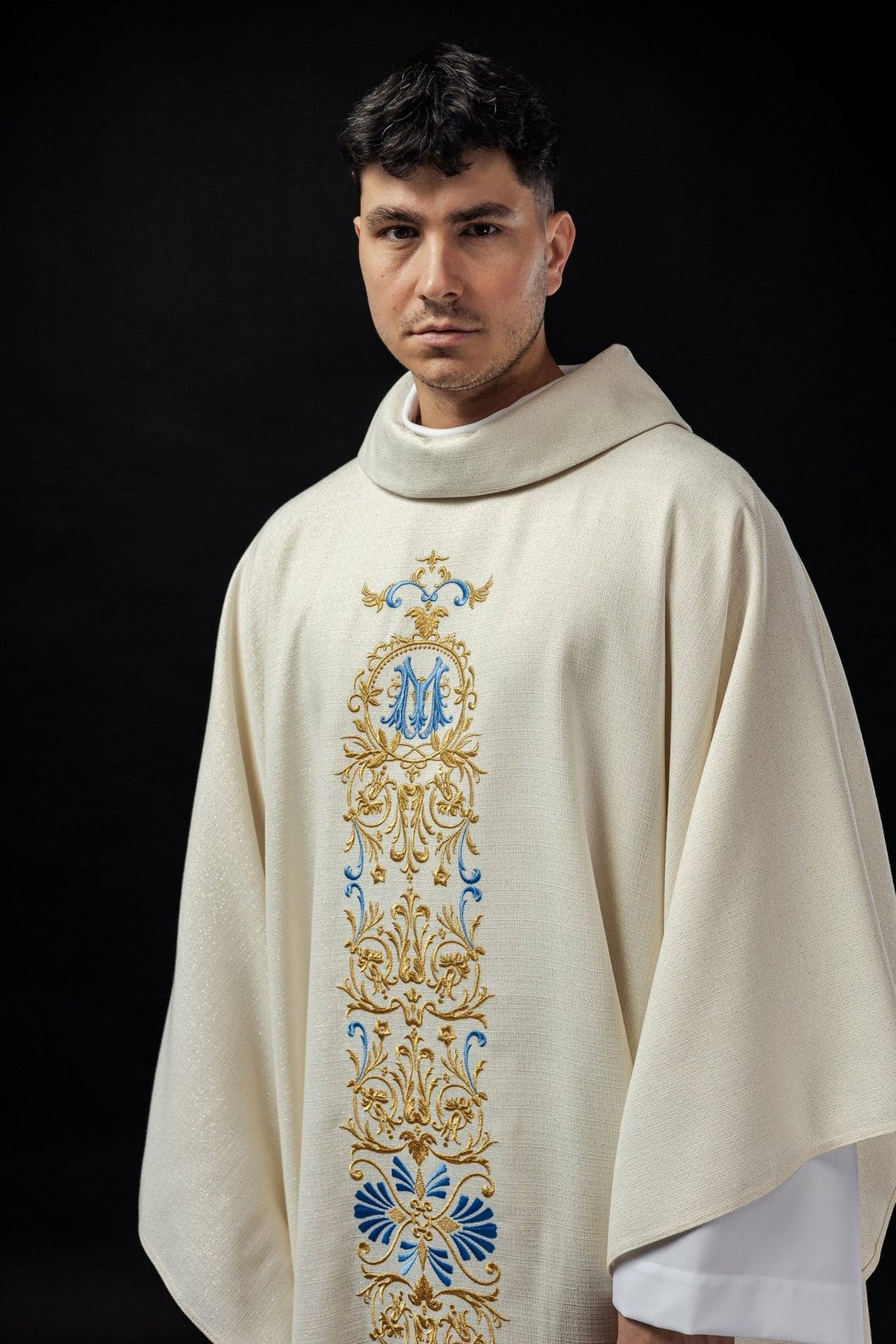 Ivory chasuble front close-up with blue and gold embroidered Marian motif