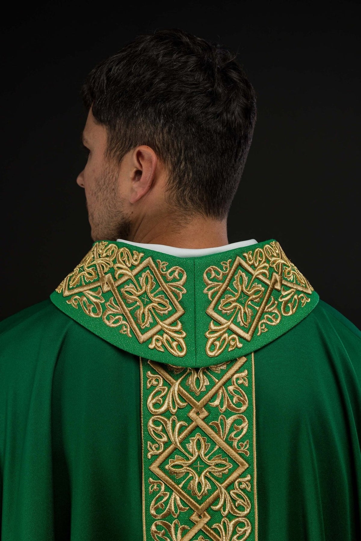 Green chasuble back close-up with embroidered collar and central trim