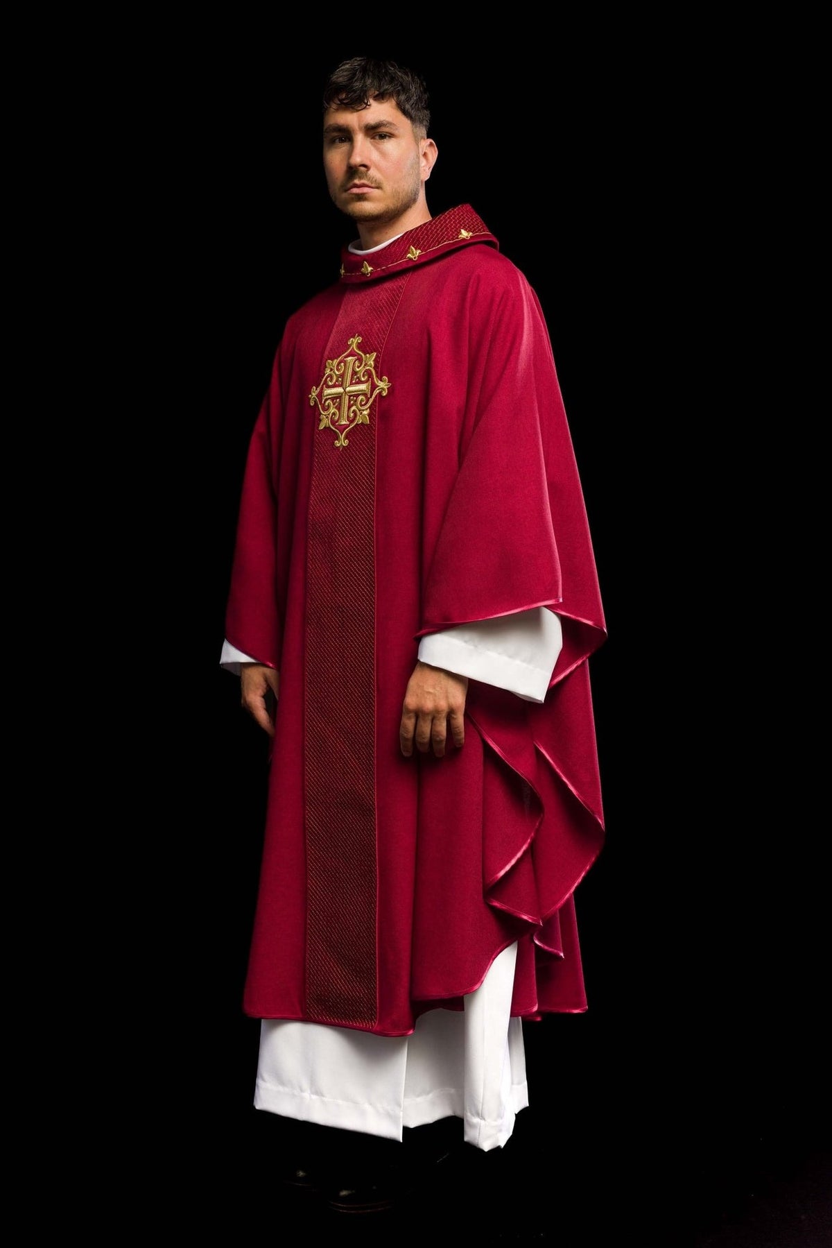 Red velvet chasuble, three-quarter front view with embroidered cross