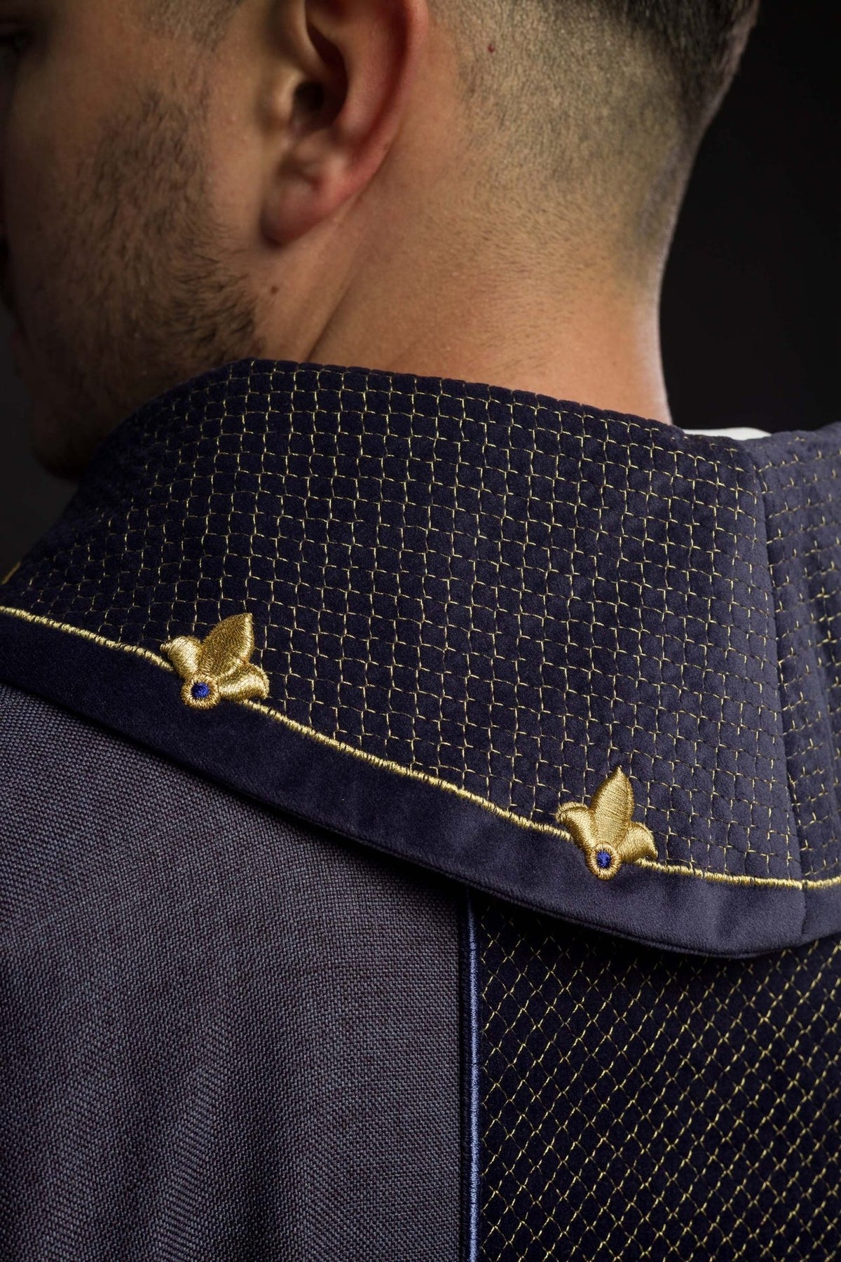 Velvet chasuble close-up showing quilted stand-up collar and gold trim