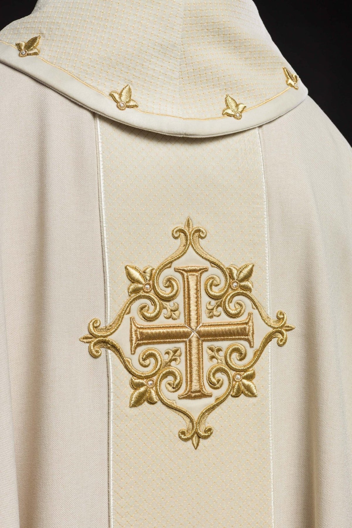 Ecru chasuble detail showing quilted collar and repeated gold embroidery