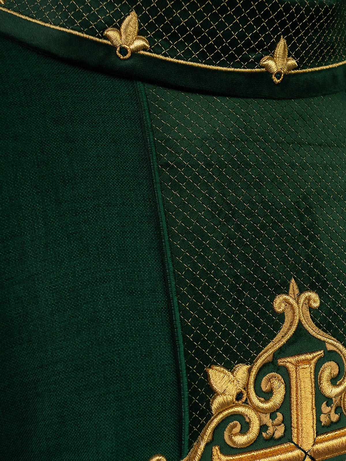 Close-up of green velvet orphrey showing gold diamond embroidery and cross detail