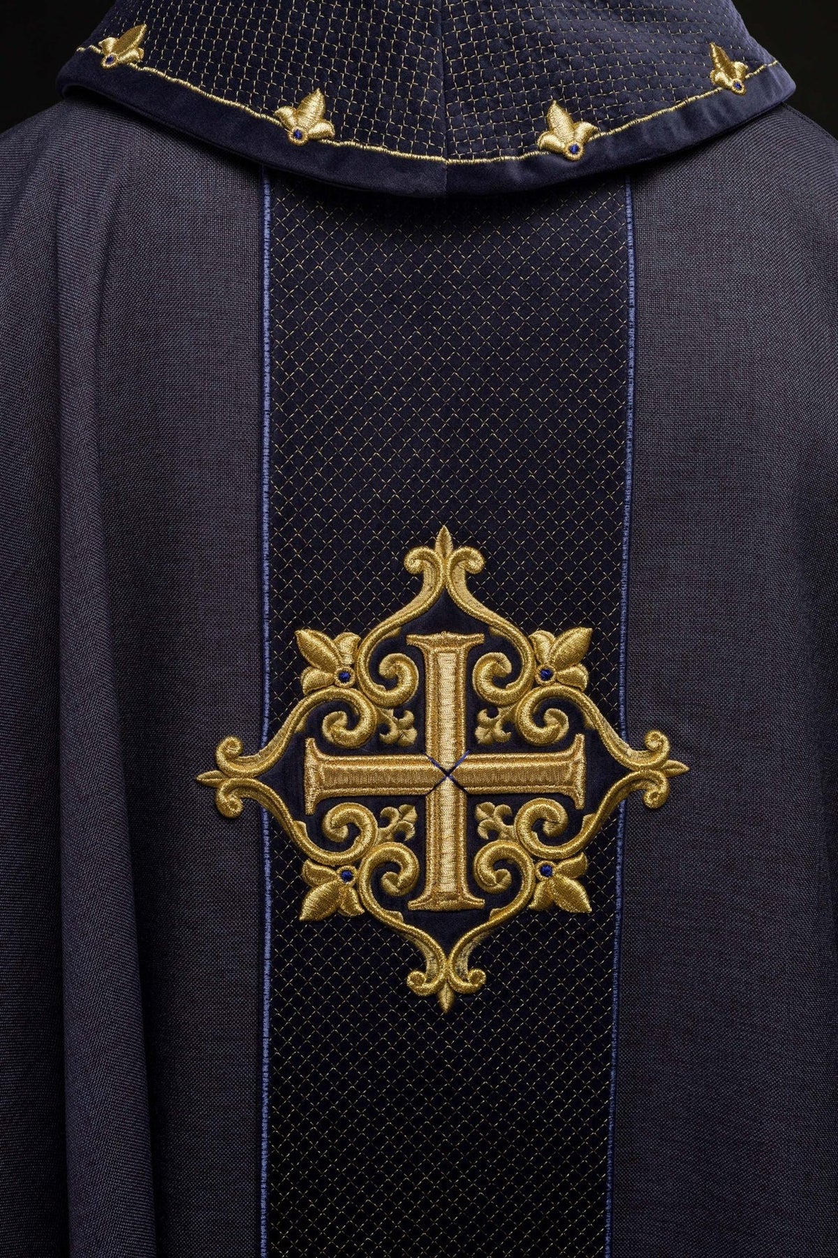Chasuble orphrey close-up with gold cross embroidery and diamond pattern