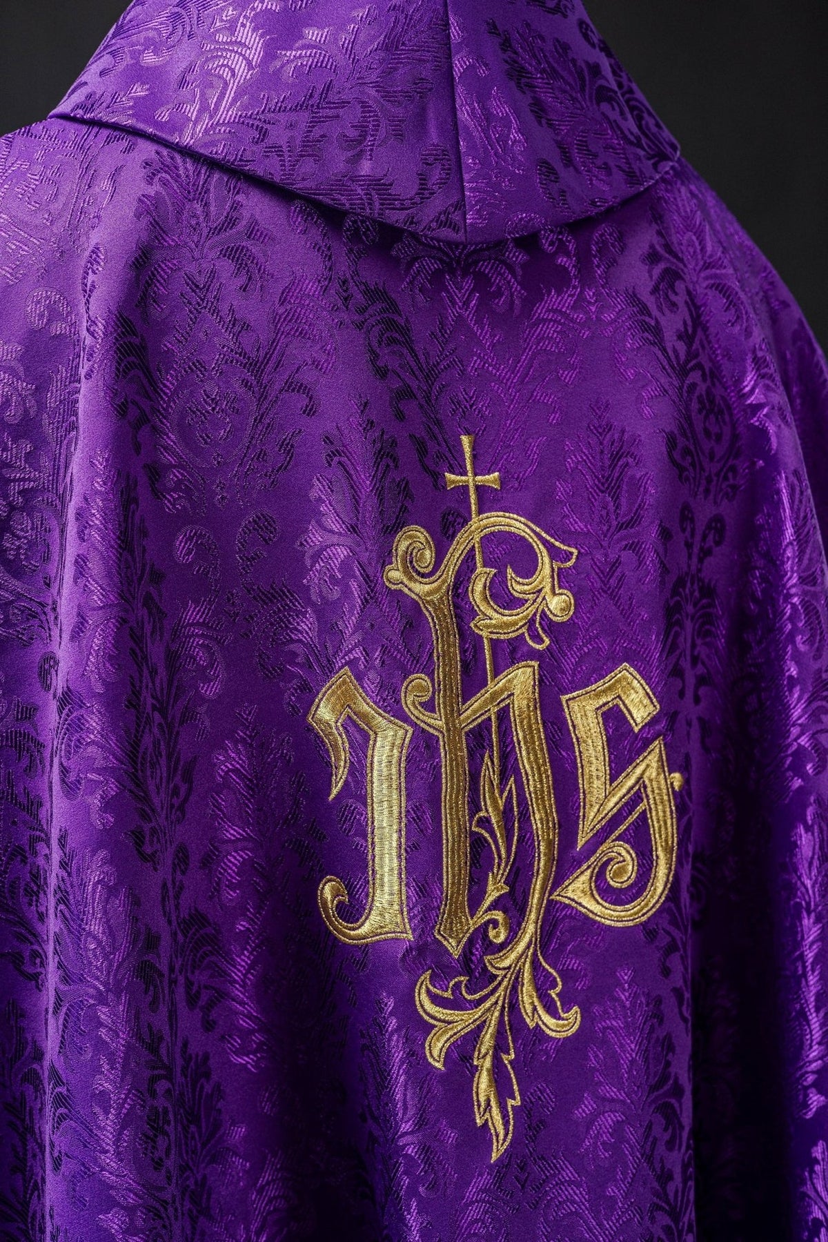 Purple chasuble close-up of stand-up collar and patterned purple fabric