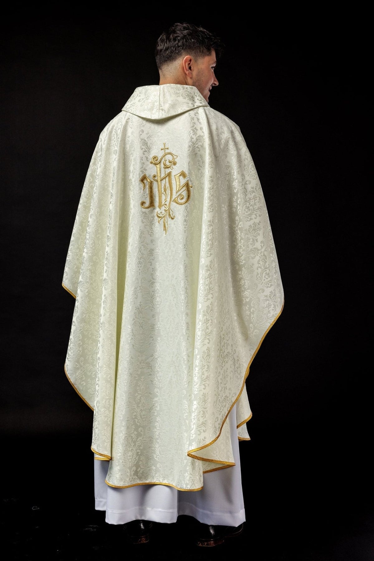 Ecru chasuble, full back view with gold trim and IHS embroidery