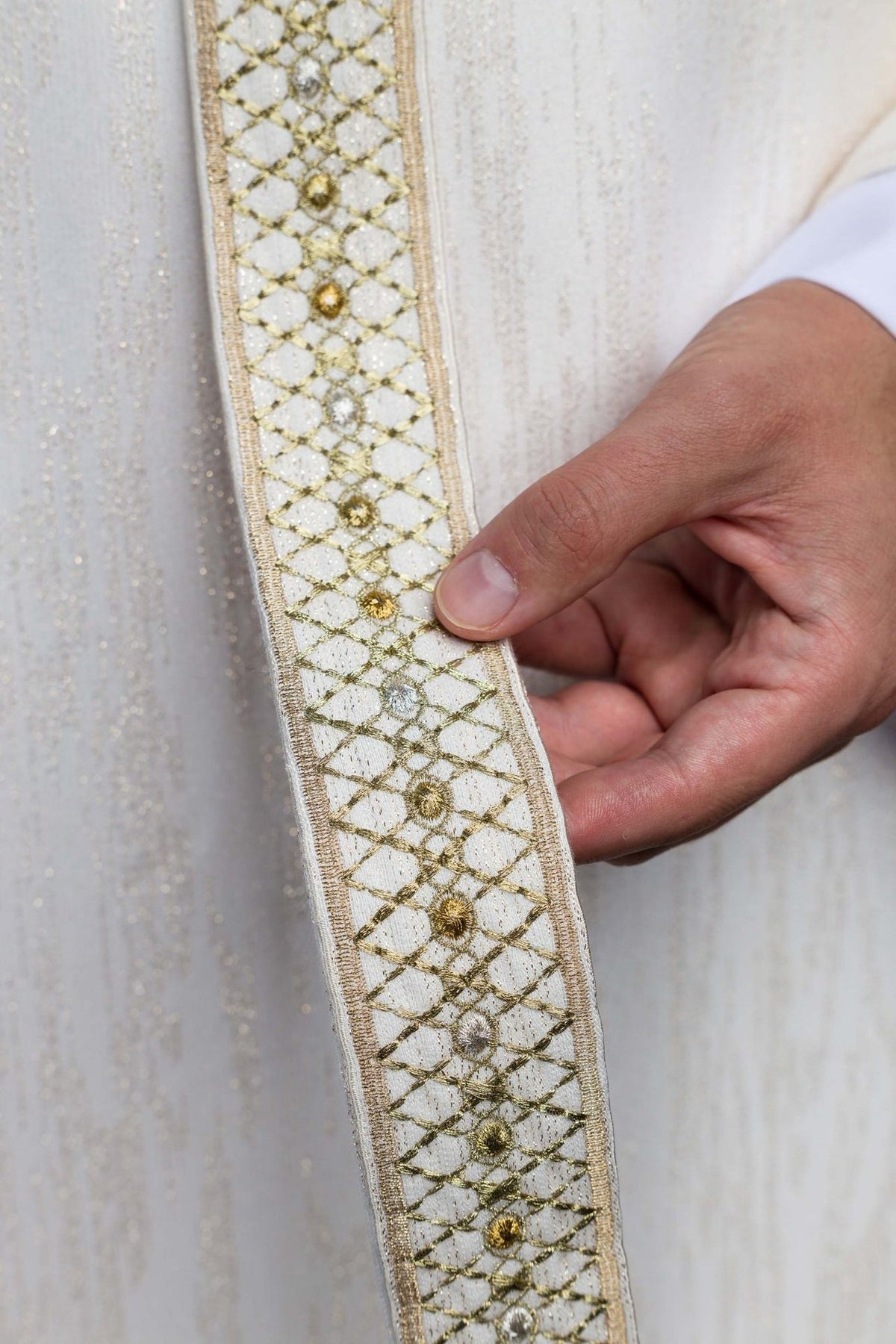 White chasuble embroidered orphrey detail with gold and silver floral motifs