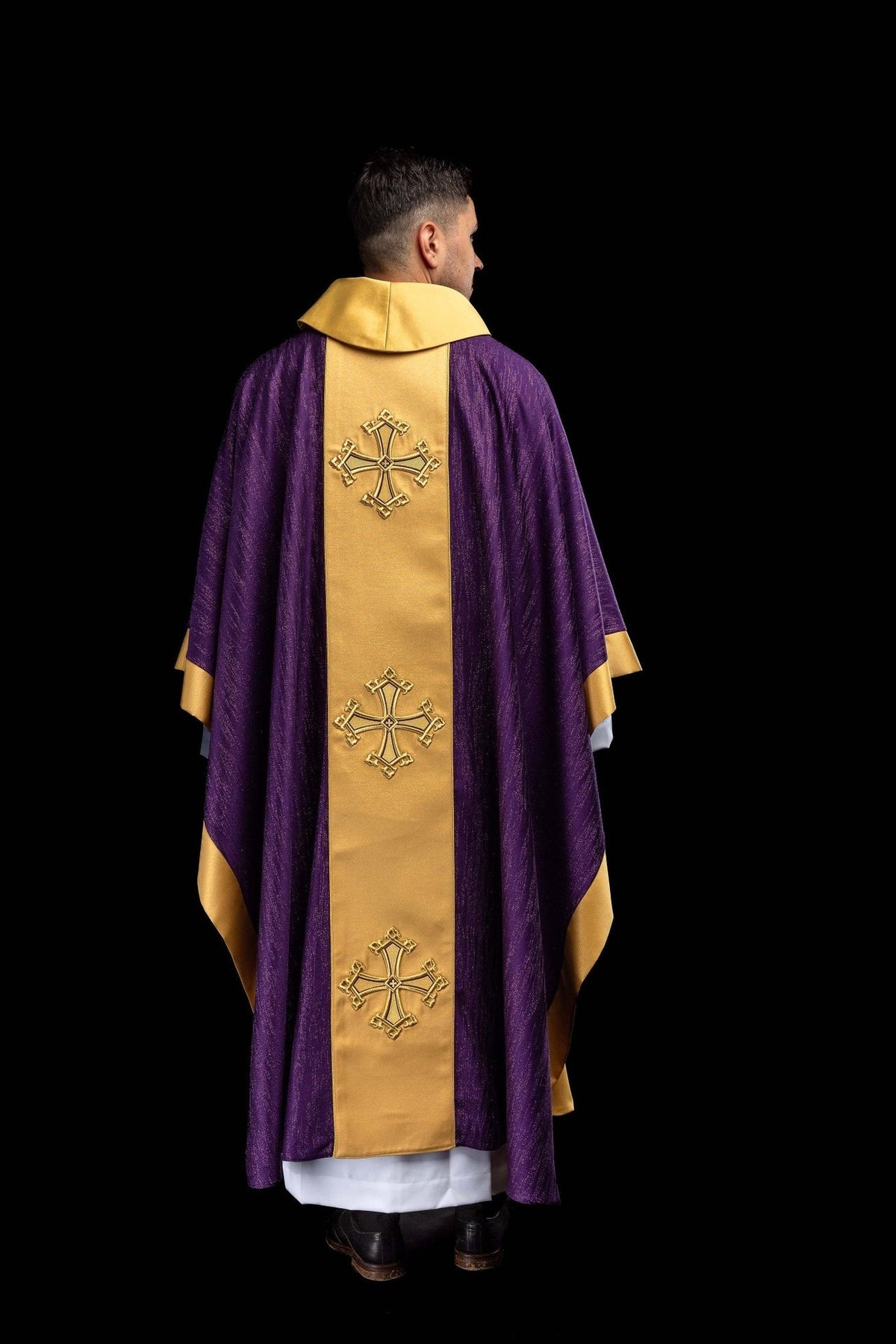 Purple chasuble back view with gold orphrey and embroidered crosses