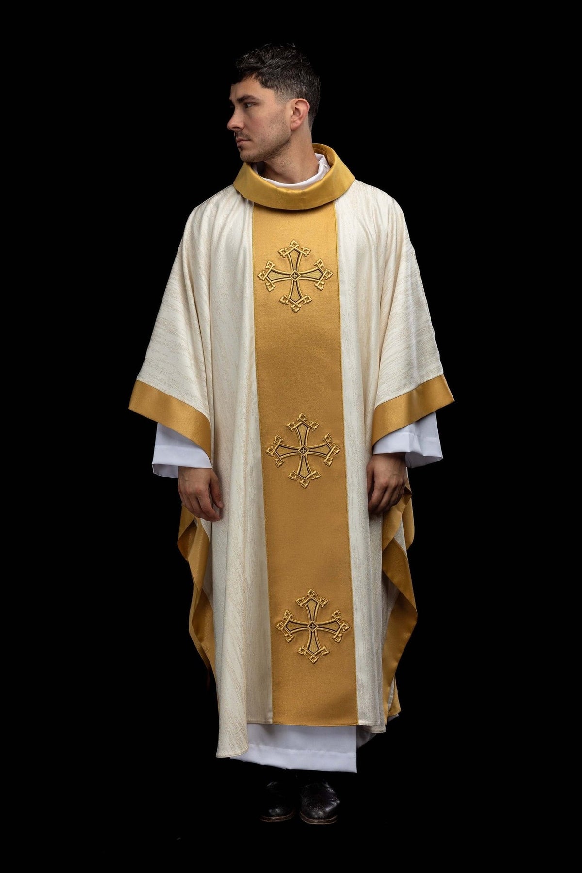 Ecru chasuble, full front view with gold embroidered crosses on the orphrey