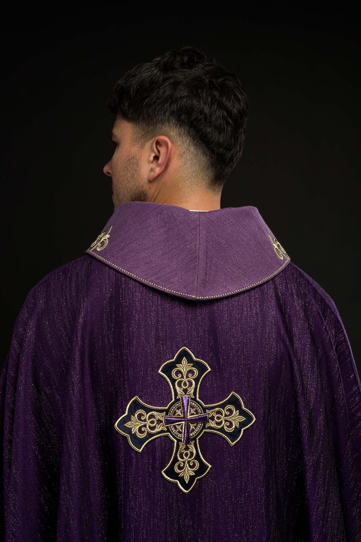 Purple chasuble back view with gold cross embroidery