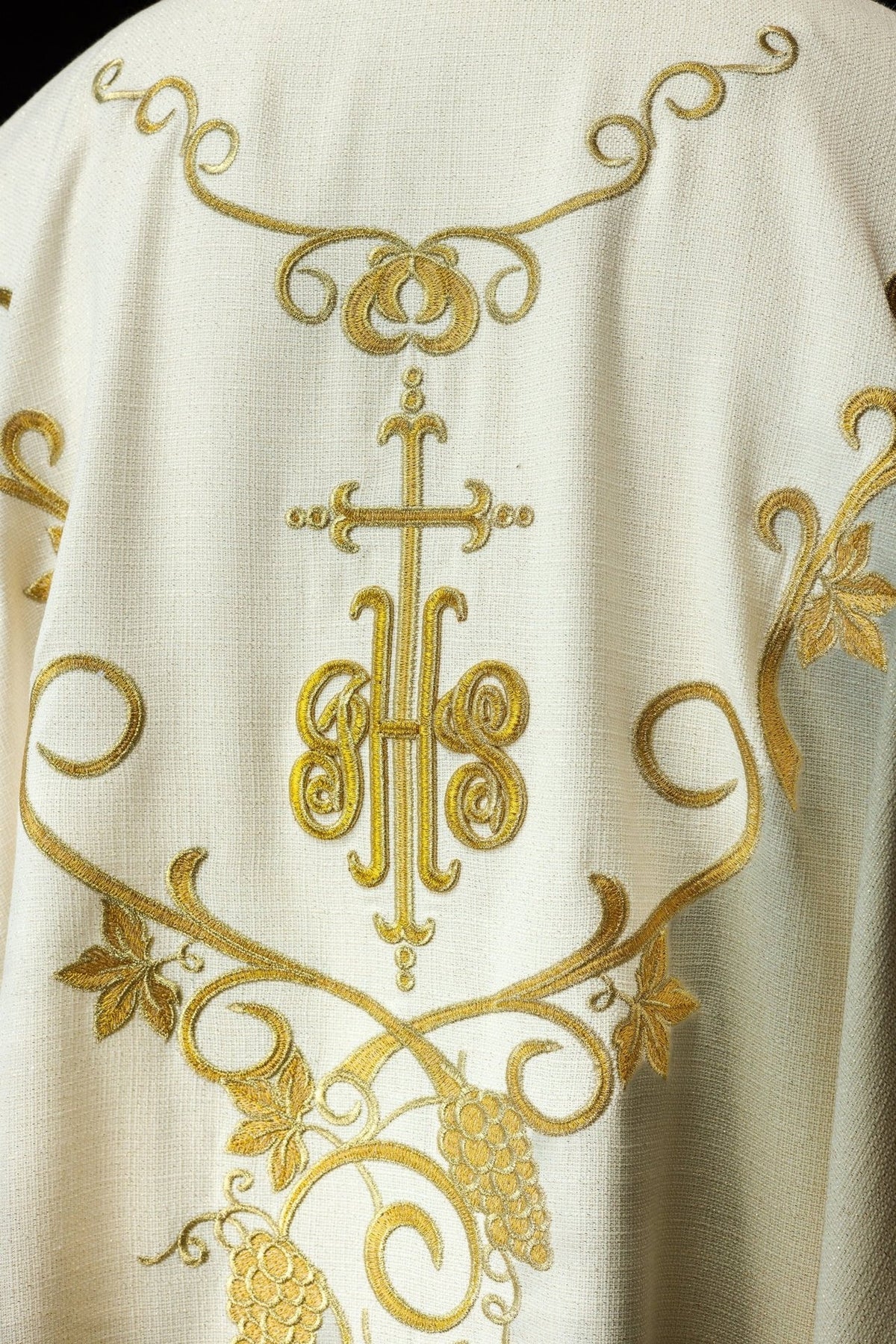 Ecru chasuble back view with gold IHS and grapes embroidery