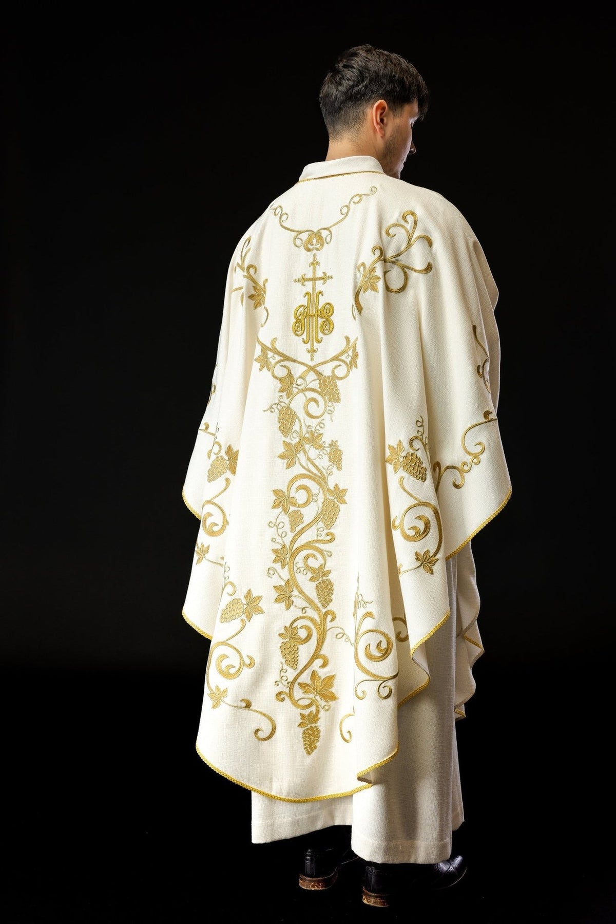 Ecru chasuble rear view showing full gold grapes embroidery