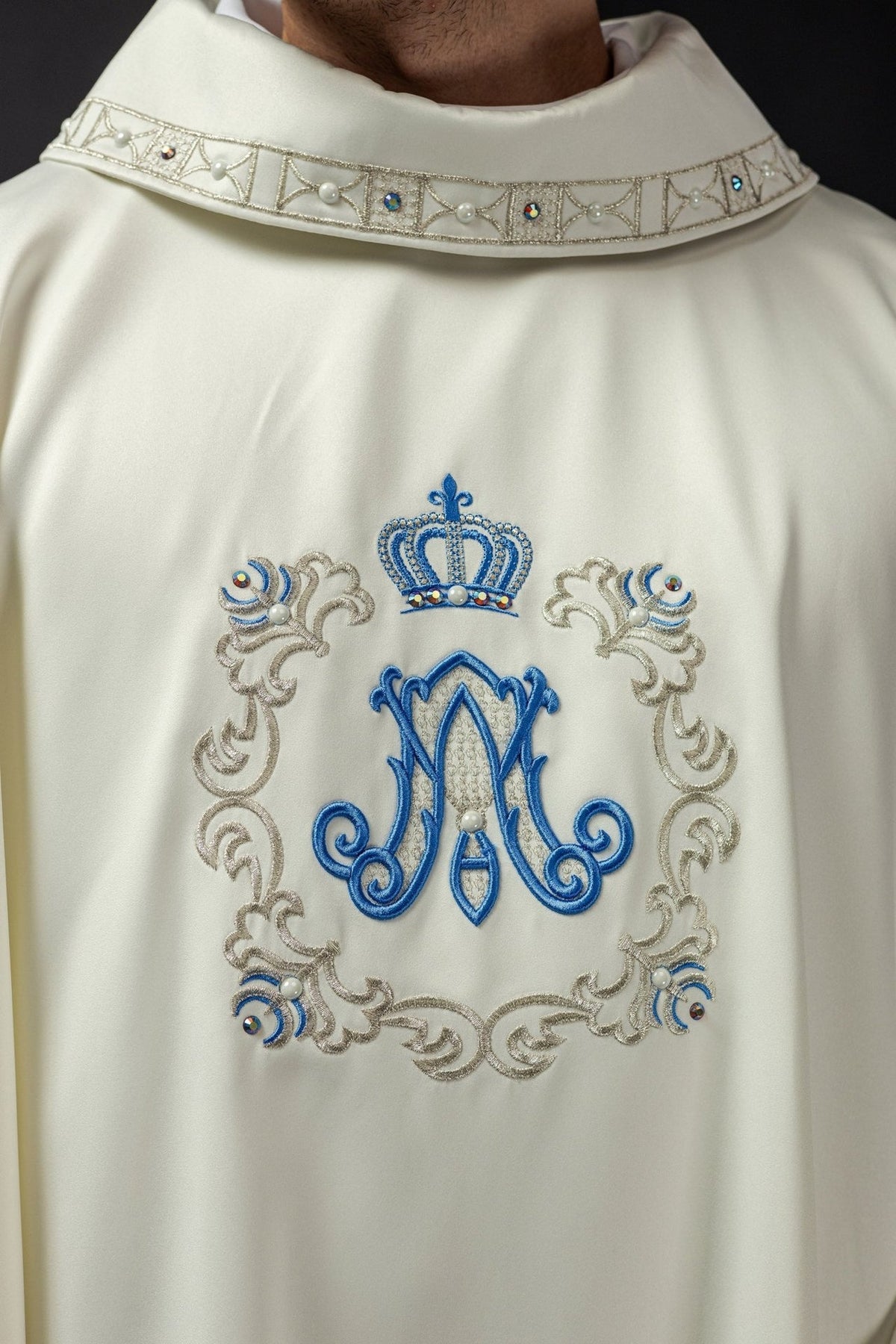 Marian chasuble front close-up with blue Marian monogram, gold crown and ornate embroidery