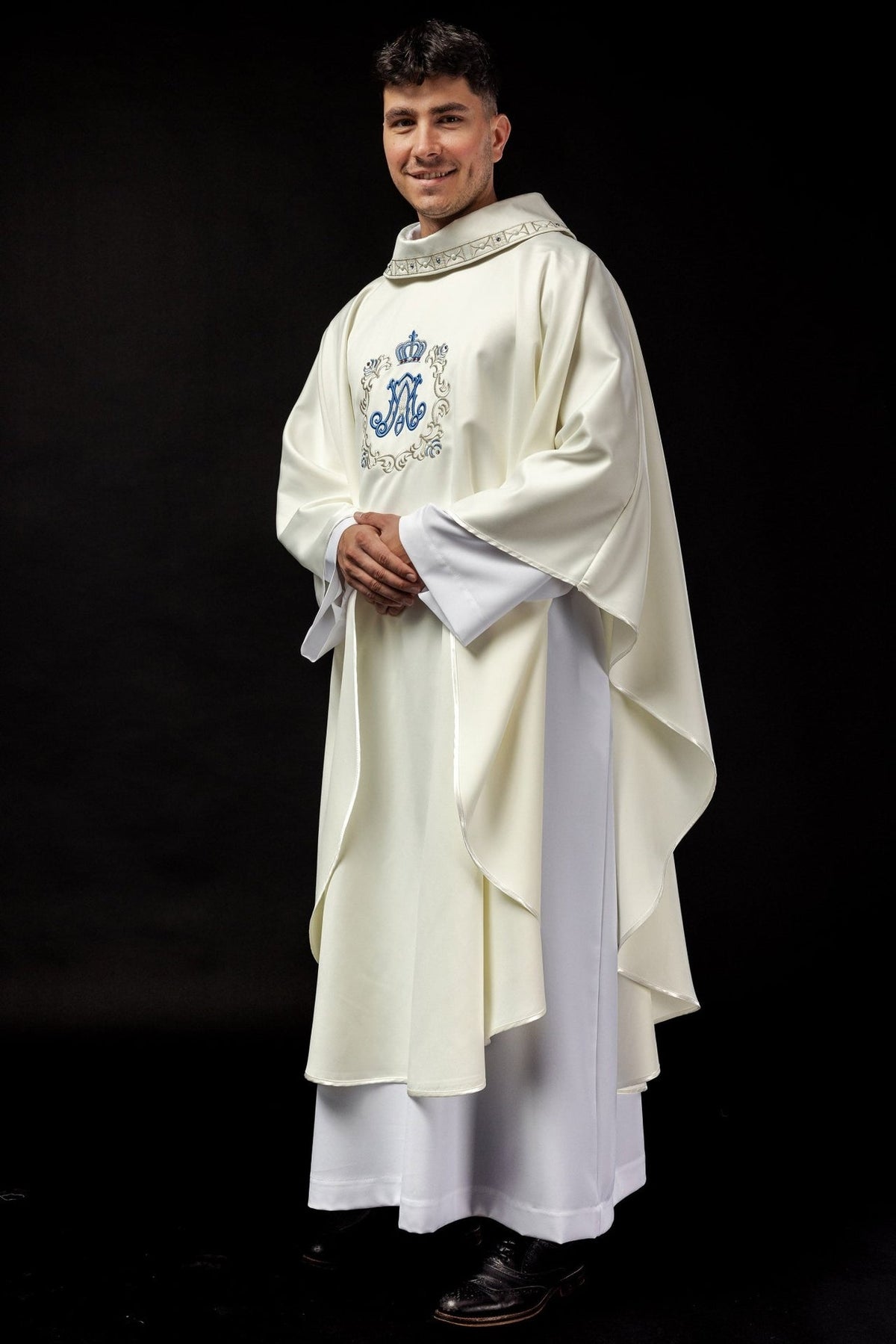 Marian chasuble three-quarter view showing ivory fabric, wide sleeves and Marian embroidery