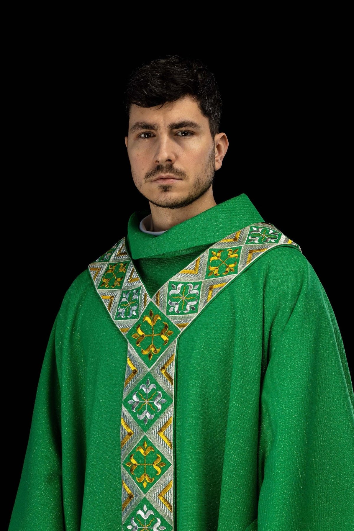 Green chasuble worn from the front, showing the embroidered orphrey and gold edging