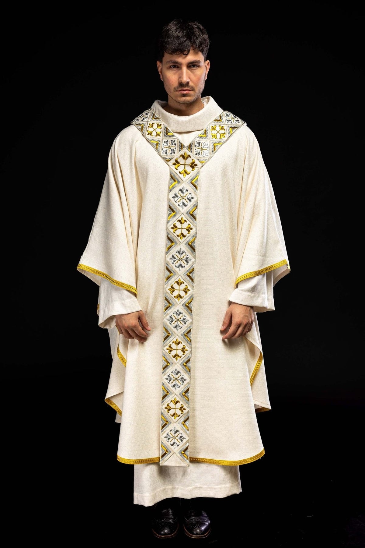 Cream chasuble set shown full length from the front with gold and silver embroidered orphrey