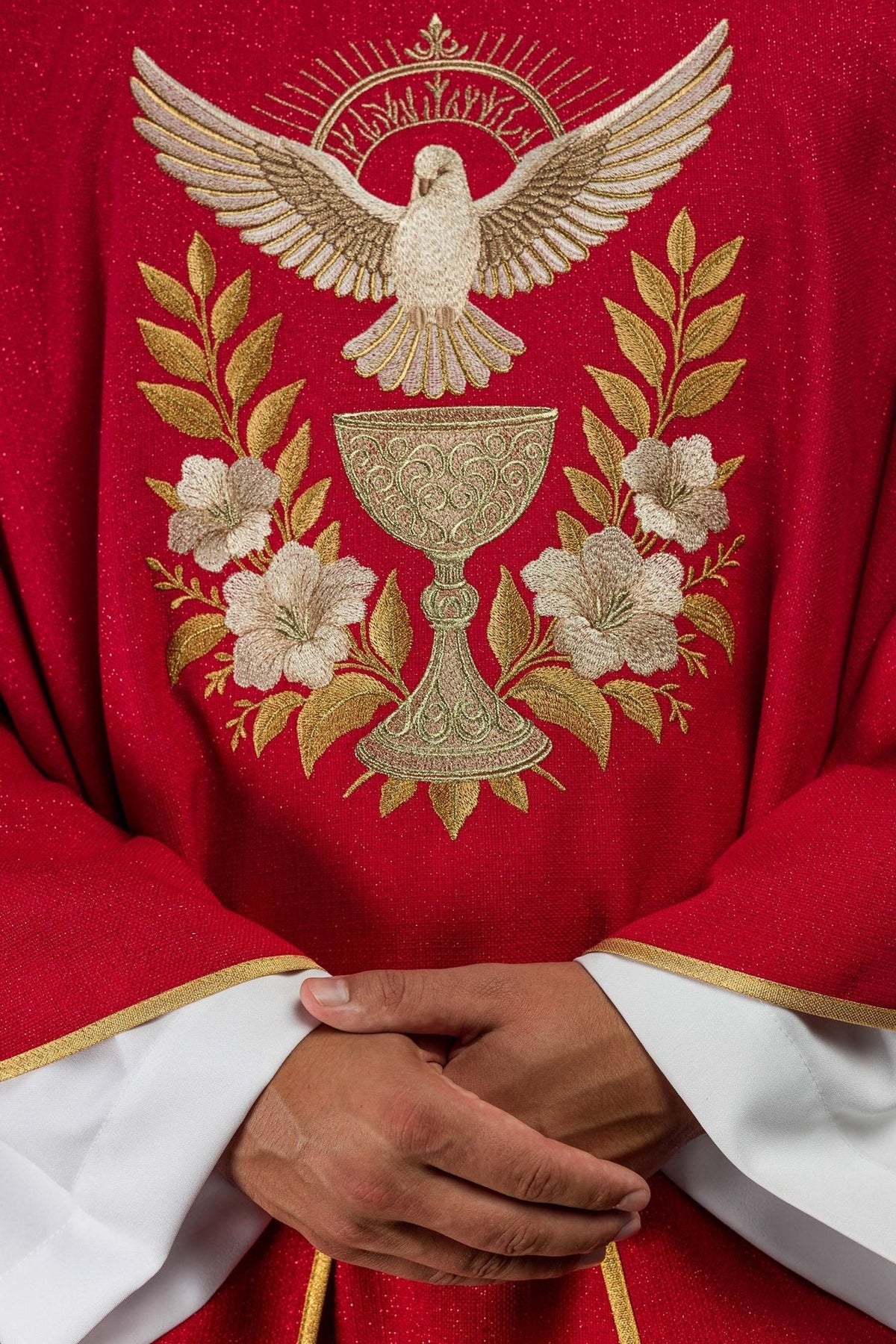 Red chasuble front close-up showing embroidered Holy Spirit, chalice, flowers and leaves