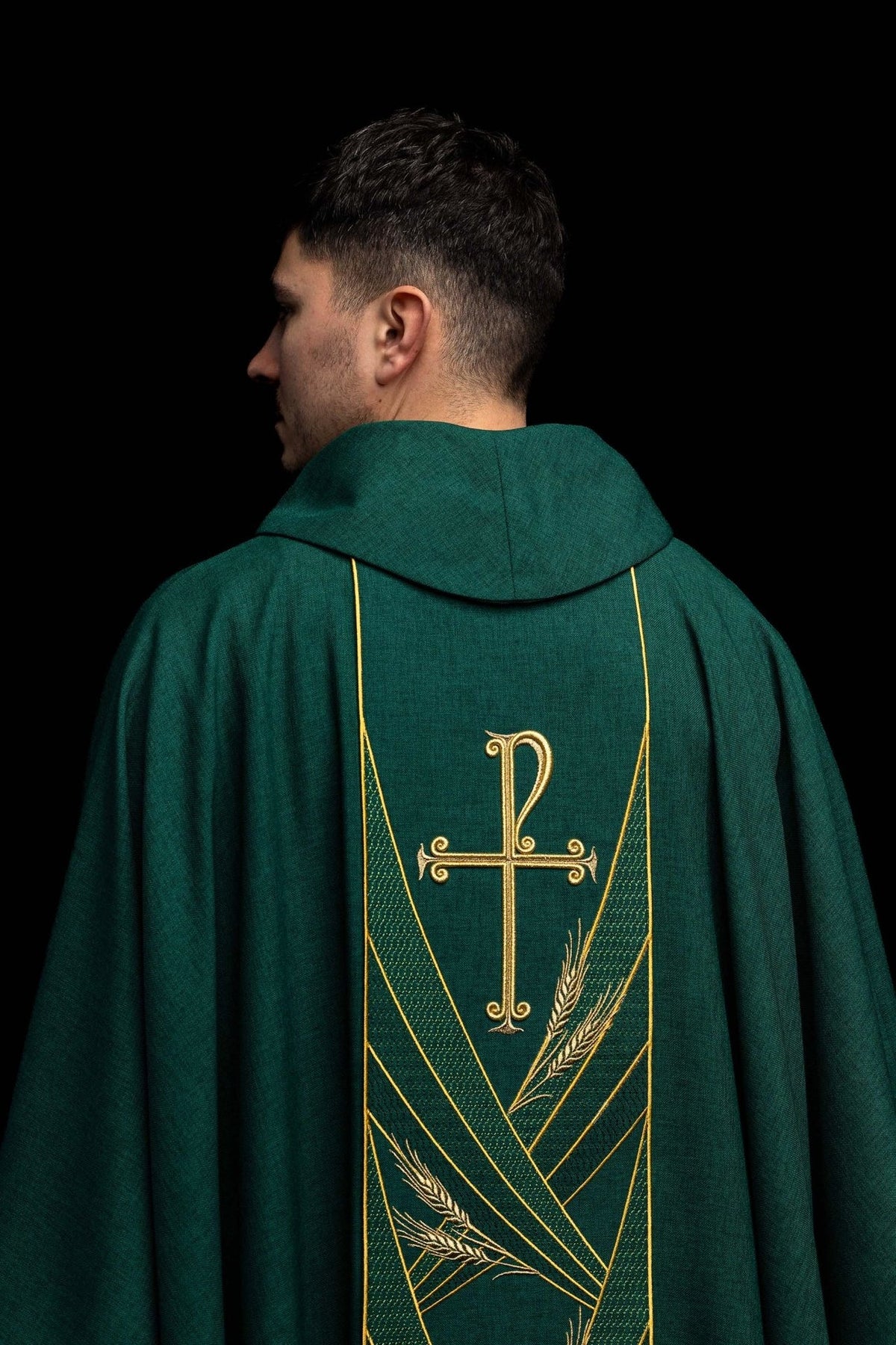 Green chasuble back view with embroidered gold cross, wheat motifs and orphrey