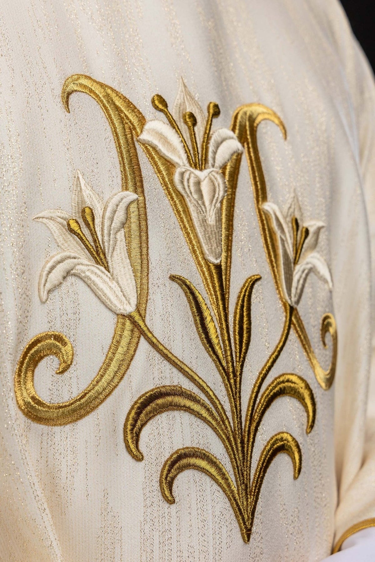 Chasuble close-up of gold and white embroidered Marian motif