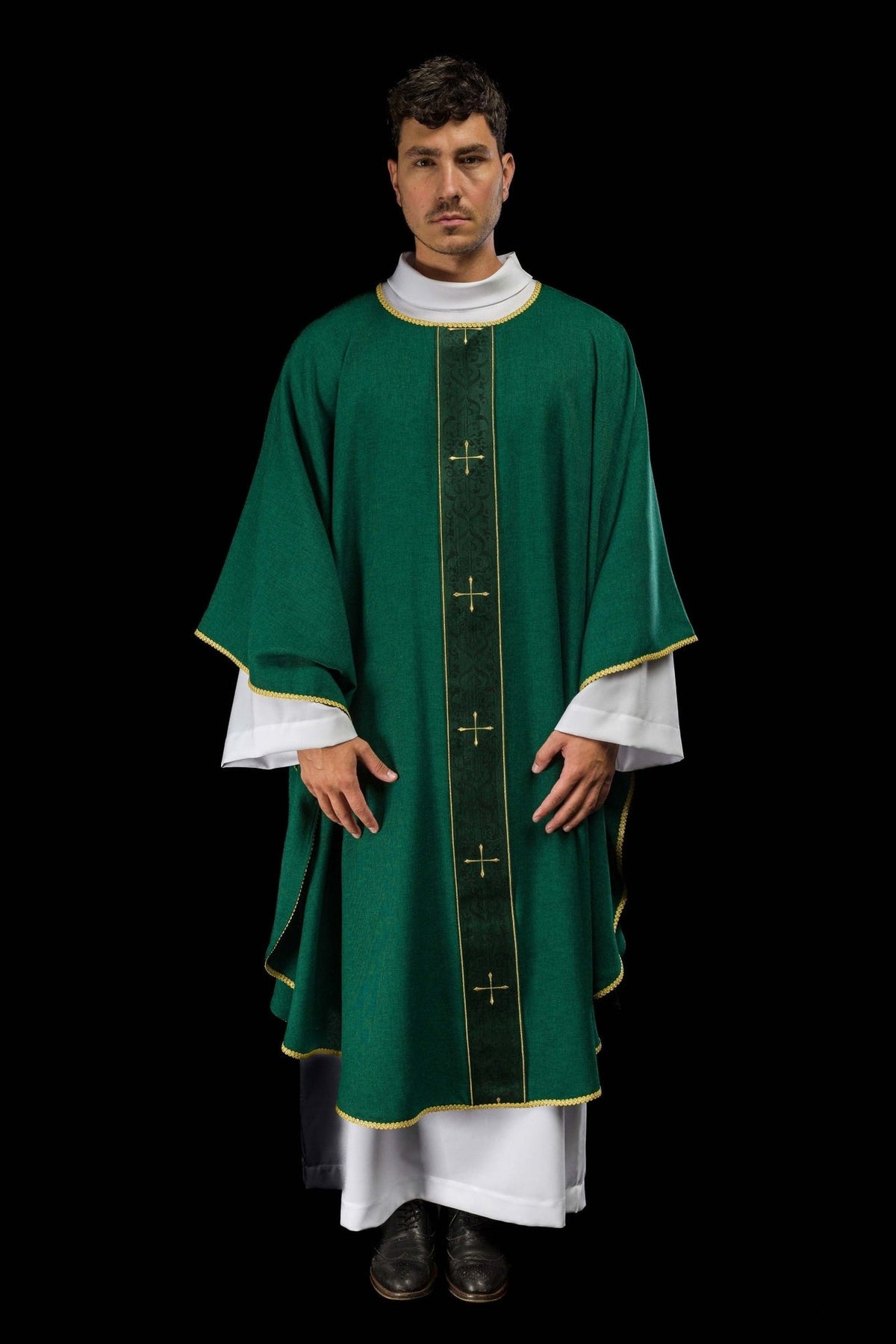 Green chasuble front view showing gold-trimmed edges and embroidered orphrey