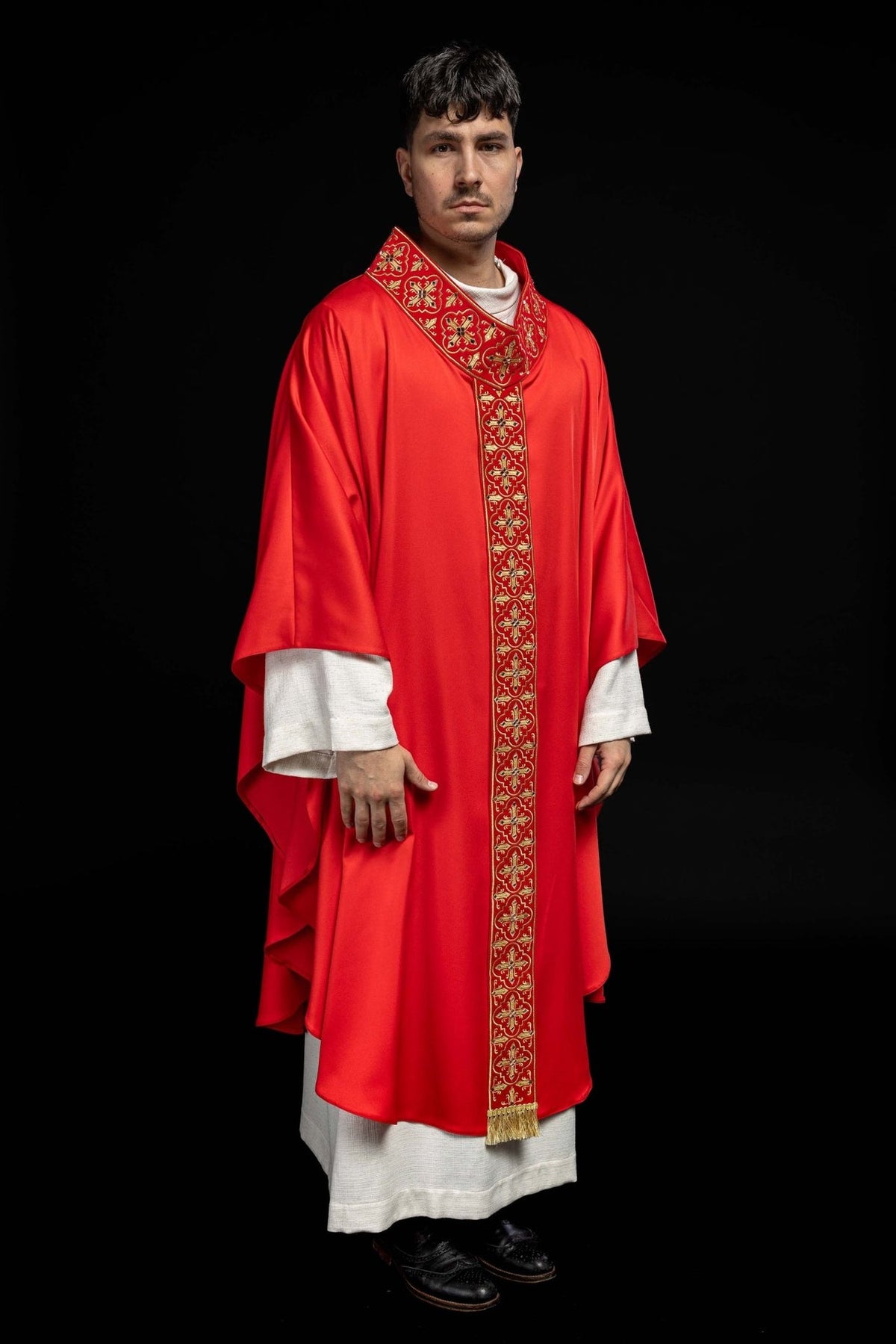 Red chasuble, full front view with narrow gold orphrey and cross motifs