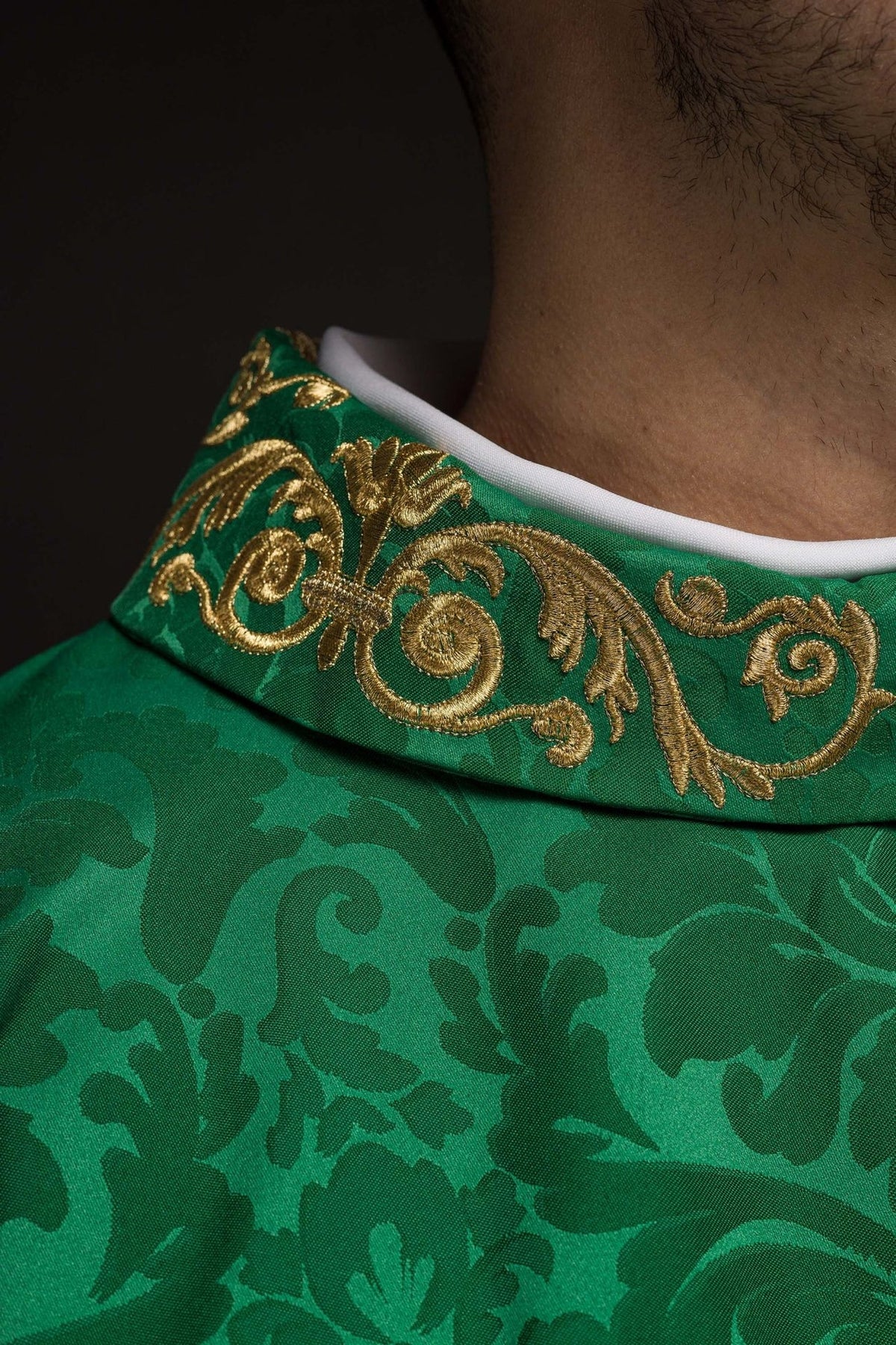 Green chasuble close-up of the embroidered stand-up collar and white neckline