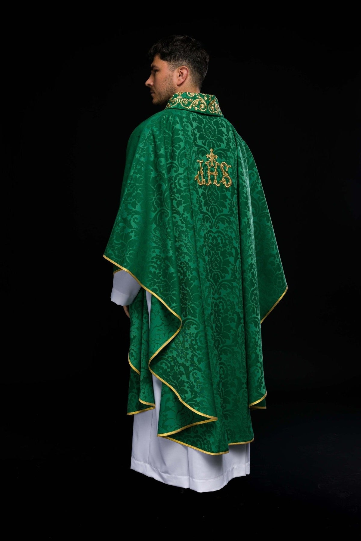 Green chasuble worn from the back with gold trim and embroidered stand-up collar