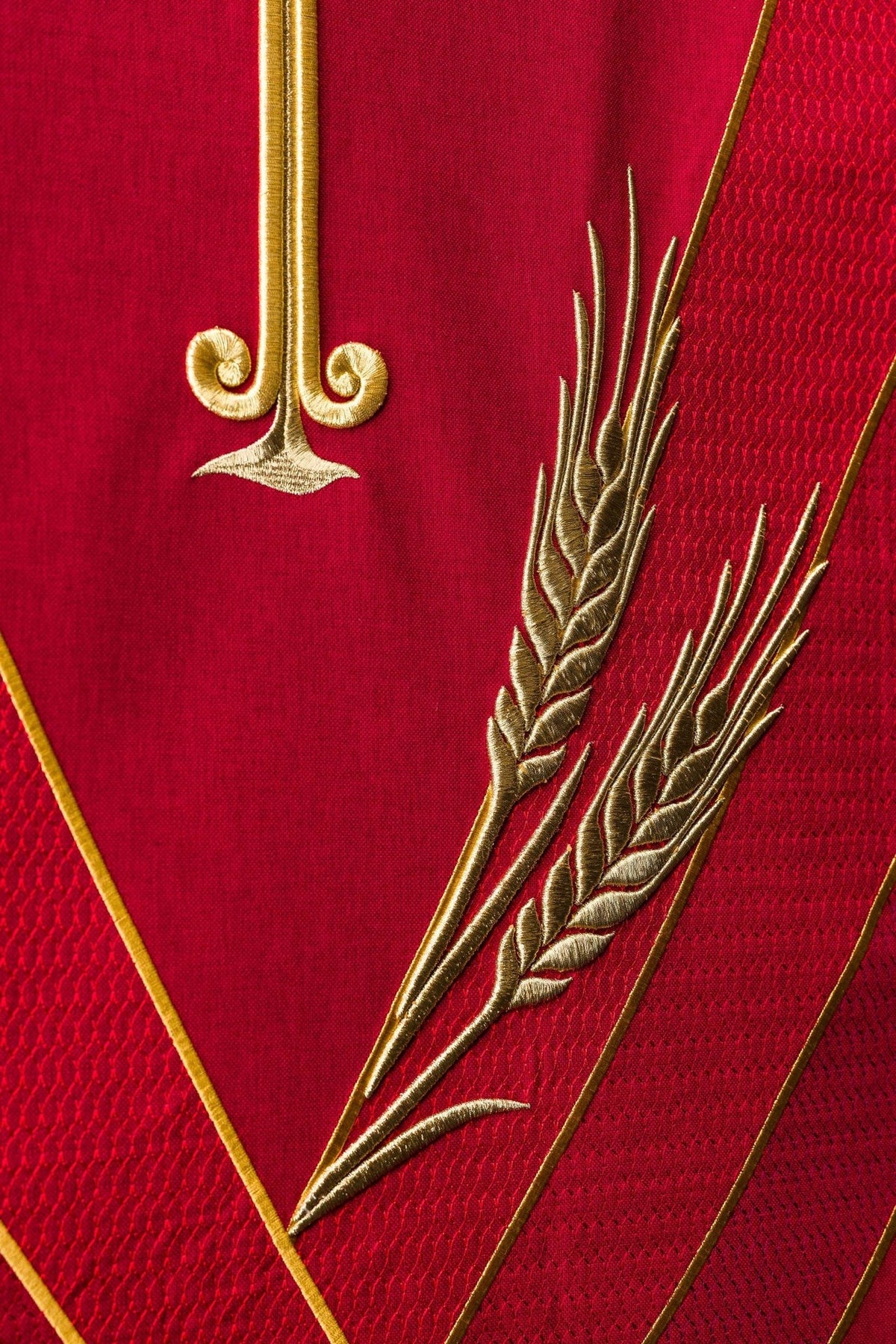 Church lectern cover detail showing gold cross base and wheat embroidery