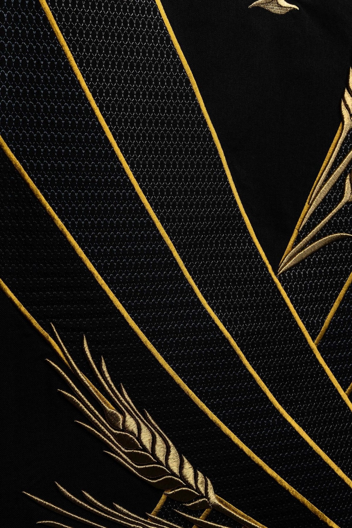 Black church lectern cover detail of textured black fabric and gold embroidered wheat