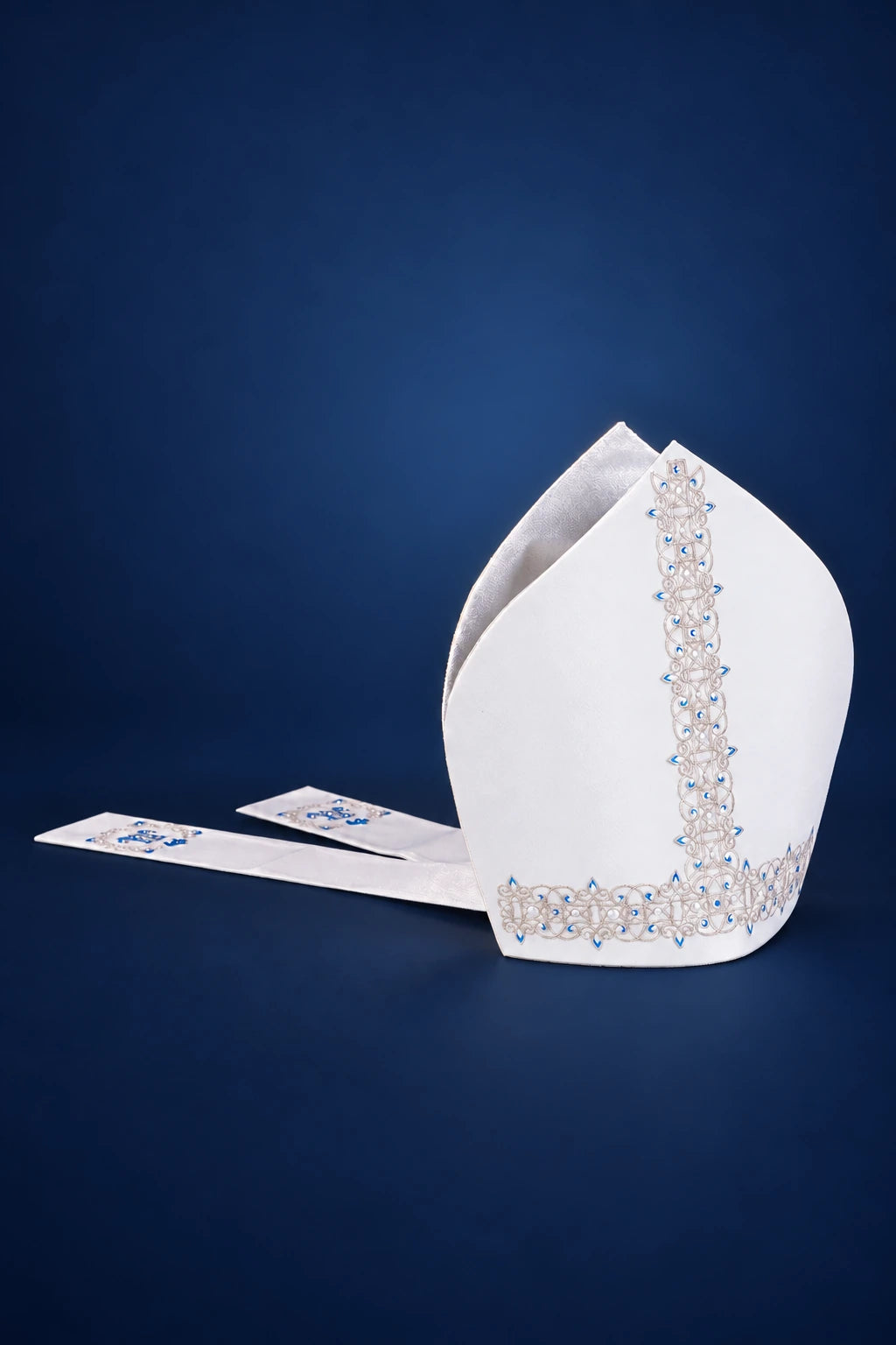 Marian Miter with Rich Embroidery, Limited Edition, white front view with blue and silver embroidery