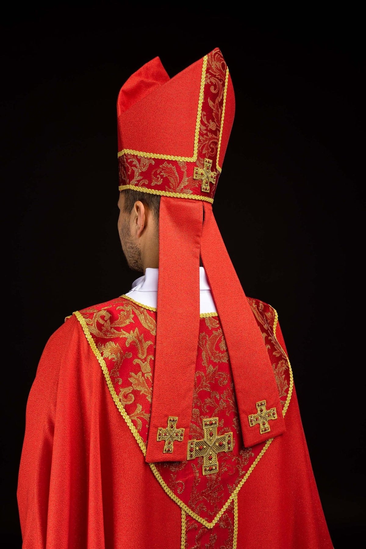 Red miter worn front view with embroidered gold cross and jacquard fabric