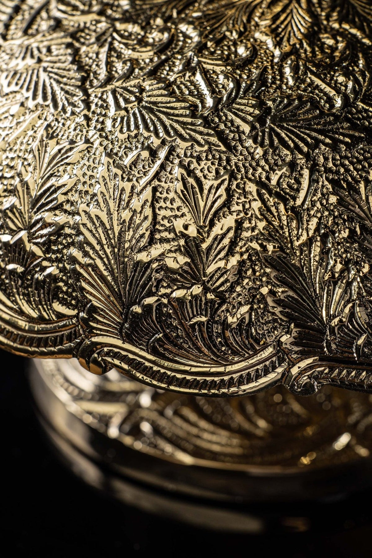 Brass altar bells, close-up of embossed floral base and rim