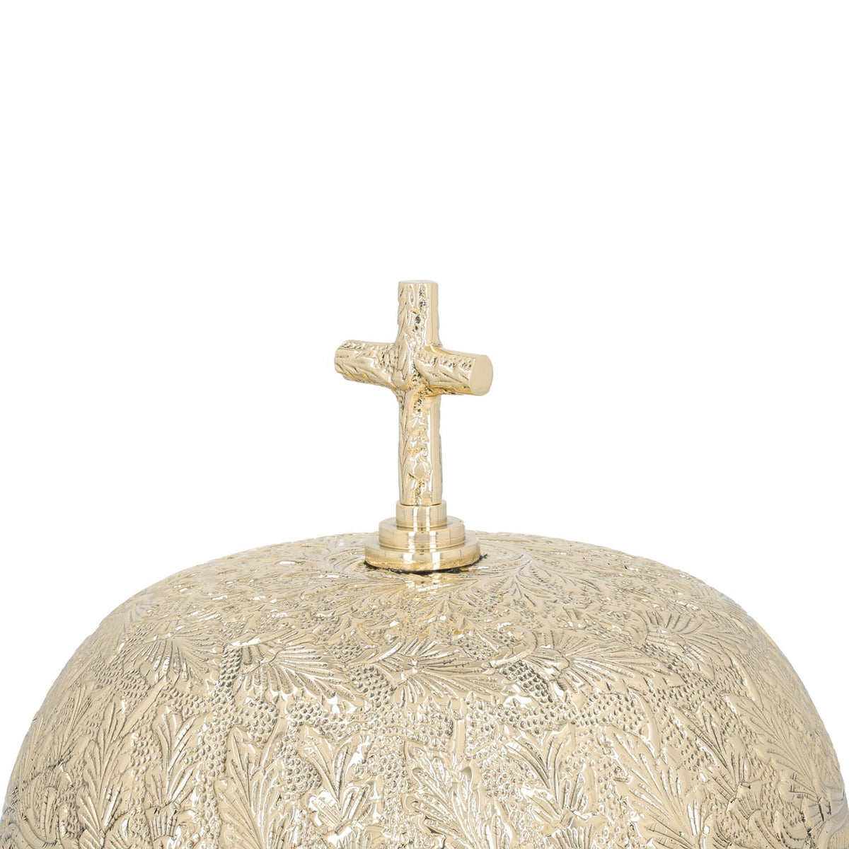 Brass altar bells, close-up of engraved cross finial and dome