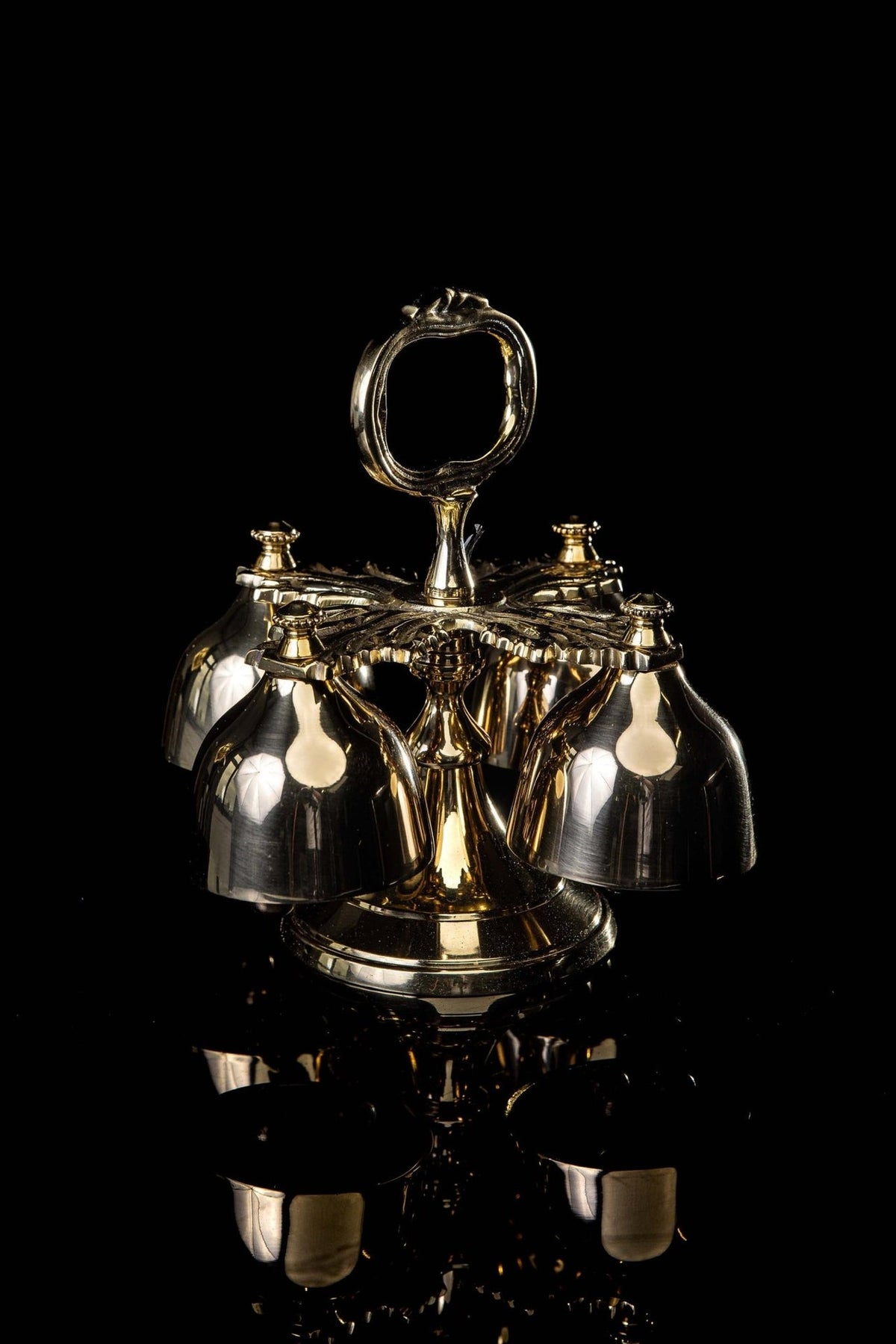 Sanctus bells front view showing four bells and decorative handle
