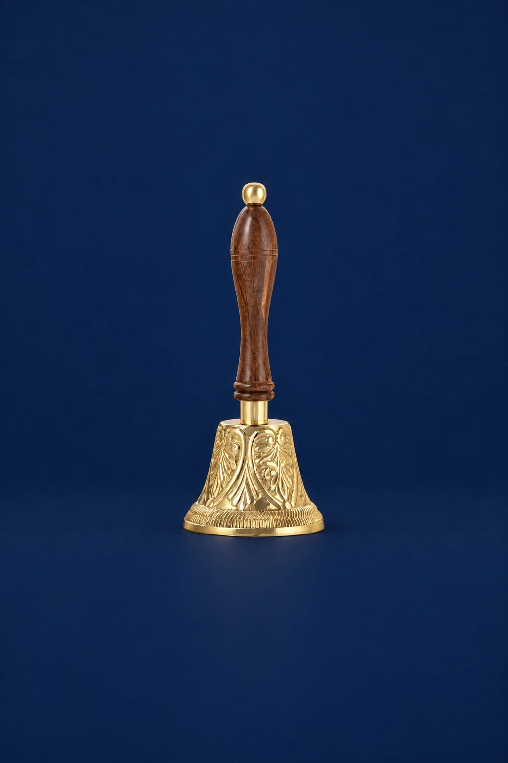 Brass Altar Bell with Wooden Handle, front view with ornate gold bell and carved brown wooden handle