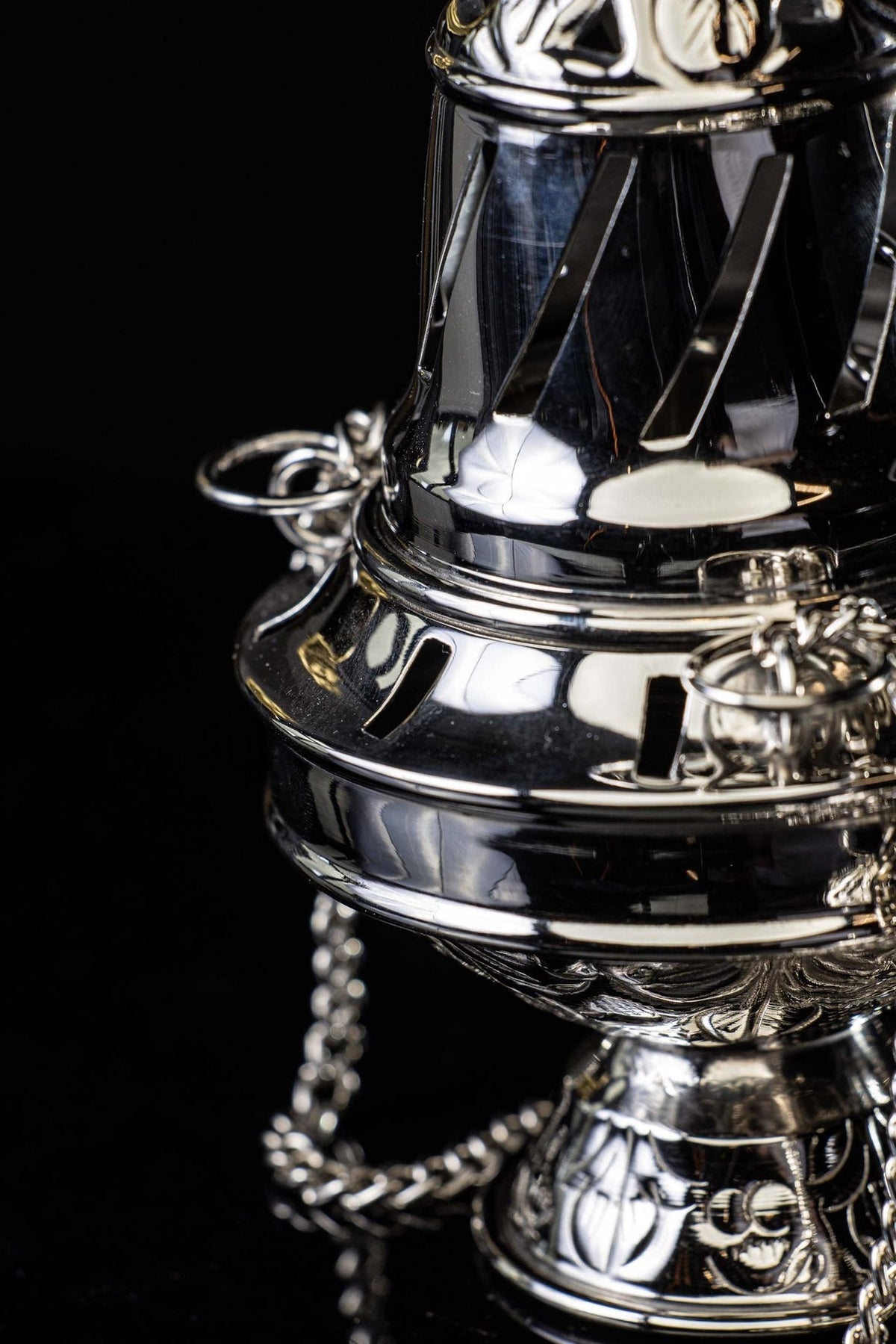 Nickel-plated brass thurible close-up of vented body and chain rings