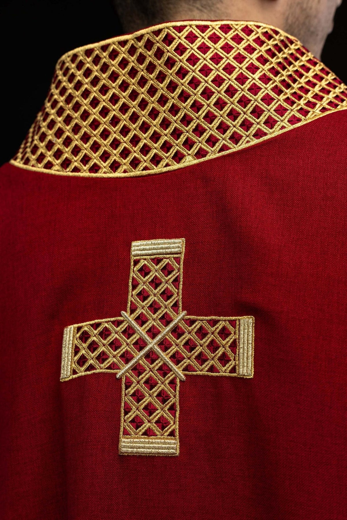 Red dalmatic back view with embroidered gold cross