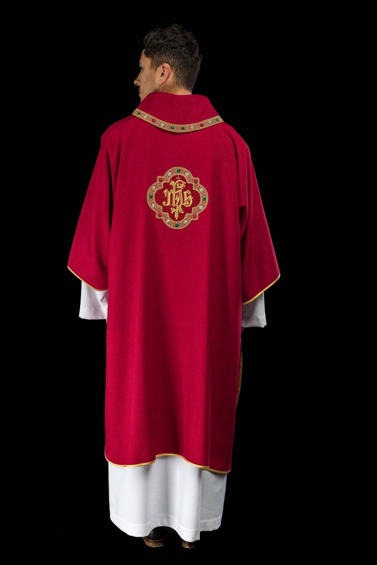 Red dalmatic full back view with embroidered IHS symbol and gold trim