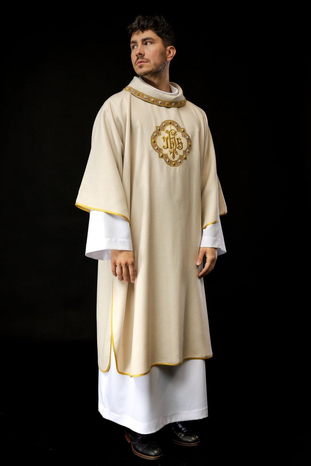 Ecru dalmatic front view with embroidered IHS symbol, ecru collar and gold trim