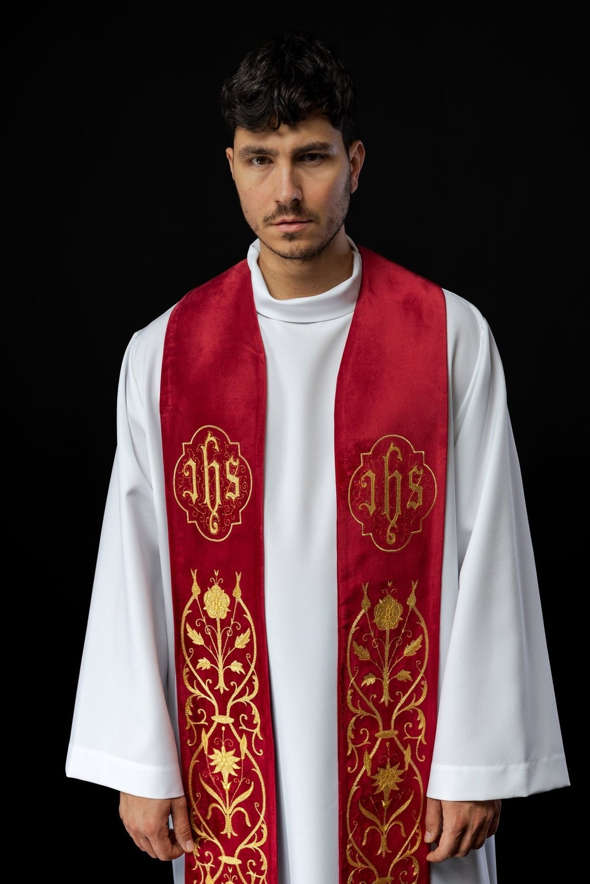 Red IHS stole worn front view, showing gold embroidery and floral motifs